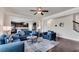 Open-concept living room flows seamlessly into the kitchen and features dark hardwood floors at 3950 Grandview Manor Dr, Cumming, GA 30028