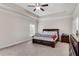 Spacious primary bedroom featuring tray ceiling, ceiling fan and neutral carpet at 3950 Grandview Manor Dr, Cumming, GA 30028