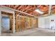 Unfinished basement with exposed insulation, frame, and concrete floor, ready for customization at 3899 Leach Rd, Snellville, GA 30039