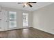 Cozy bedroom with updated flooring, light walls, and bright natural light from double windows at 3899 Leach Rd, Snellville, GA 30039