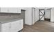 Kitchen featuring modern cabinets, granite countertops and view of barn door at 3899 Leach Rd, Snellville, GA 30039