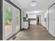 Open kitchen with white cabinets, stainless steel appliances, and deck access at 3899 Leach Rd, Snellville, GA 30039