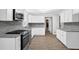 Updated kitchen with granite counters, stainless appliances, and plenty of counterspace at 3899 Leach Rd, Snellville, GA 30039