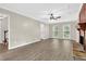 Bright living room features updated flooring, a classic fireplace, and many windows for natural light at 3899 Leach Rd, Snellville, GA 30039