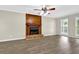 The living room features new floors, a wood fireplace with brick surround, and large windows at 3899 Leach Rd, Snellville, GA 30039