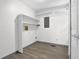 Small room with shelves and wood-look flooring at 3899 Leach Rd, Snellville, GA 30039