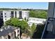 Balcony with a view of nearby apartment buildings and mature trees at 711 Cosmopolitan Ne Dr # 715, Atlanta, GA 30324