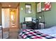 Bedroom with carpeted floor, and a desk area with a view of the bathroom at 711 Cosmopolitan Ne Dr # 715, Atlanta, GA 30324