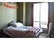 Bedroom with a large window, soft lighting, and a comfortable bed at 711 Cosmopolitan Ne Dr # 715, Atlanta, GA 30324