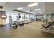Well-equipped gym with treadmills, ellipticals, weights, and mirrored wall at 711 Cosmopolitan Ne Dr # 715, Atlanta, GA 30324