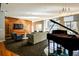 Elegant lounge area with grand piano, stylish seating, and natural light at 711 Cosmopolitan Ne Dr # 715, Atlanta, GA 30324