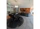 Comfortable lounge area with a piano, TV, sofas, and modern decor at 711 Cosmopolitan Ne Dr # 715, Atlanta, GA 30324