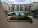 Beautiful view of the pool area with multiple lounge chairs and umbrellas at 711 Cosmopolitan Ne Dr # 715, Atlanta, GA 30324