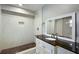 Bathroom featuring a tiled shower, updated fixtures, and a granite countertop vanity at 3207 Bobbie Ln, Decatur, GA 30032