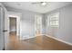 Bedroom with hardwood floors and three doorways at 3207 Bobbie Ln, Decatur, GA 30032