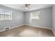 Bright bedroom with hardwood floors, two large windows, and neutral paint at 3207 Bobbie Ln, Decatur, GA 30032
