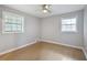 Cozy bedroom with hardwood floors, natural light, and a ceiling fan at 3207 Bobbie Ln, Decatur, GA 30032