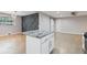 Bright kitchen featuring an island with granite countertop, pendant lighting, and stainless steel appliances at 3207 Bobbie Ln, Decatur, GA 30032