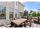 Outdoor deck with a dining table, grill, and seating area, perfect for entertaining at 3295 Millwood Se Trl, Smyrna, GA 30080