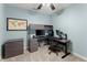 Bedroom featuring a built-in desk with shelving and two computer monitors, perfect for study at 3295 Millwood Se Trl, Smyrna, GA 30080