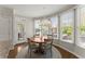 Sunny breakfast nook with round table, chandelier, and views of the outdoors at 3295 Millwood Se Trl, Smyrna, GA 30080
