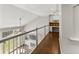 Upstairs hallway featuring hardwood floors, built in desk with cabinets, and white trim at 3295 Millwood Se Trl, Smyrna, GA 30080