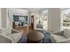 Inviting living space featuring hardwood floors and view into dining room at 3295 Millwood Se Trl, Smyrna, GA 30080