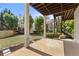 Covered patio overlooking landscaped backyard with lush green lawn and mature trees, perfect for outdoor living at 3295 Millwood Se Trl, Smyrna, GA 30080