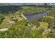 An aerial view of a lake next to baseball and soccer fields surrounded by dense woods with the city skyline in the distance at 3982 Battleford Ct, Atlanta, GA 30341