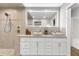 Elegant bathroom with double vanity, oversized mirror and walk-in shower at 3982 Battleford Ct, Atlanta, GA 30341