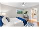 Serene bedroom featuring hardwood floors, a window, and an ensuite bathroom at 3982 Battleford Ct, Atlanta, GA 30341