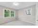Bedroom with double hung windows, base molding, and carpet flooring at 3982 Battleford Ct, Atlanta, GA 30341