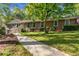Charming brick home with well-maintained landscaping and a sidewalk leading to the entrance at 3982 Battleford Ct, Atlanta, GA 30341