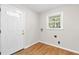 Bright mud room boasts hardwood floors, window and connections for washer/dryer at 3982 Battleford Ct, Atlanta, GA 30341