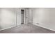 Bedroom featuring an open closet with neutral carpet and paint at 4983 Needle Knob Ct, Lithonia, GA 30038