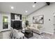 Cozy living room features a black stone fireplace with white mantel and patio access at 4983 Needle Knob Ct, Lithonia, GA 30038
