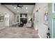 Bright living room boasts a fireplace, beamed ceilings, neutral tones, and an open doorway to the kitchen at 4983 Needle Knob Ct, Lithonia, GA 30038