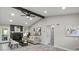 Bright living room features a fireplace, beamed ceilings, neutral color palette, and lots of natural light at 4983 Needle Knob Ct, Lithonia, GA 30038