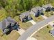 The property has a manicured lawn, and is one of many homes in this suburban aerial view at 5780 Winding Lakes Dr, Cumming, GA 30028