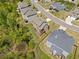 A home is seen from above, including the fenced in yard, landscaping, and neighborhood at 5780 Winding Lakes Dr, Cumming, GA 30028
