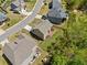 This aerial shot shows the backyard and proximity to neighbors in a suburban community at 5780 Winding Lakes Dr, Cumming, GA 30028
