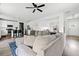 Open floor plan features a modern kitchen with a cozy living room and fireplace at 5780 Winding Lakes Dr, Cumming, GA 30028