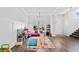 Spacious living room with hardwood floors, playroom area, and lots of natural light at 5780 Winding Lakes Dr, Cumming, GA 30028