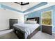 Spacious main bedroom with a large bed, matching nightstands, and plenty of natural light at 5780 Winding Lakes Dr, Cumming, GA 30028
