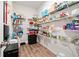 Walk-in pantry with ample shelving and storage space for kitchen supplies at 5780 Winding Lakes Dr, Cumming, GA 30028