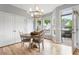 Bright dining room with hardwood floors, a chandelier, and a door opening to an outdoor area at 2238 Parkview Nw Ct, Atlanta, GA 30318