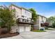 Exterior view of townhomes with decks and attached garages on a sunny day at 2238 Parkview Nw Ct, Atlanta, GA 30318