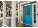 Close-up of a bright blue front door with white trim and sidelights at 2238 Parkview Nw Ct, Atlanta, GA 30318