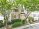 Charming two-story home with stone accents, a cozy porch, and lush landscaping at 2238 Parkview Nw Ct, Atlanta, GA 30318