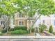 Charming two-story home with stone accents, inviting front porch, and lush landscaping at 2238 Parkview Nw Ct, Atlanta, GA 30318